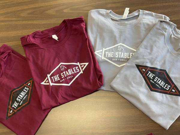 T-shirts with the Stables logo. 